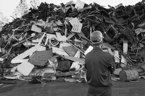 Workers performing builders waste clearance in New Cross