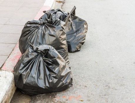 Professional waste management team sorting construction debris