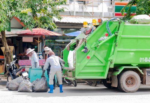Modern waste clearance truck at a construction site